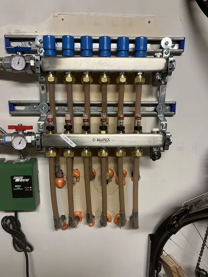 Plumber performing Water Heater Repair at a residential property in Watauga